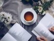 white-ceramic-teacup-with-saucer-near-two-books-above-gray-904616